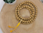 Preview: Rattan "Lotus" Mala-Gebetskette | 108+1 Perlen | gold-braun